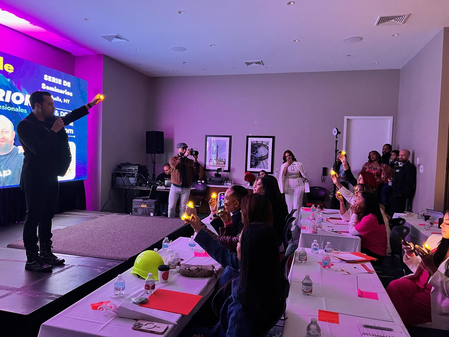 Franco leading a workshop in a small room